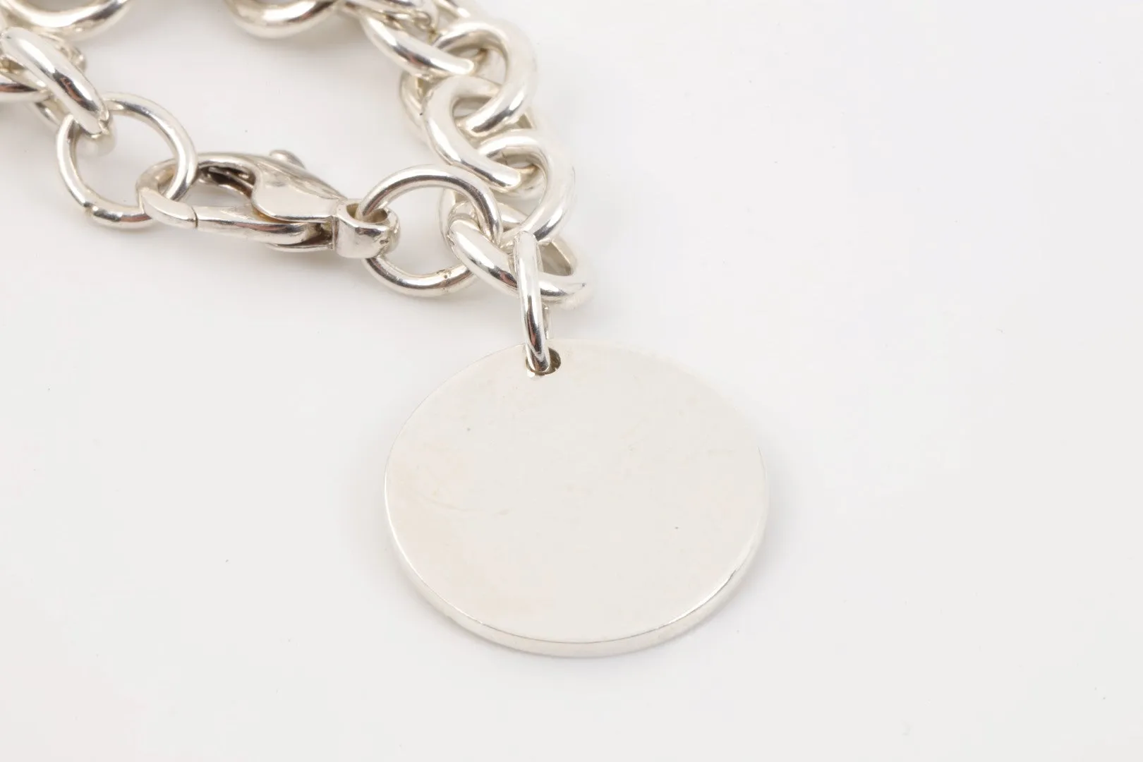 7.5" Tiffany & Co. 925 Silver Round Tag Bracelet (36.56g.)