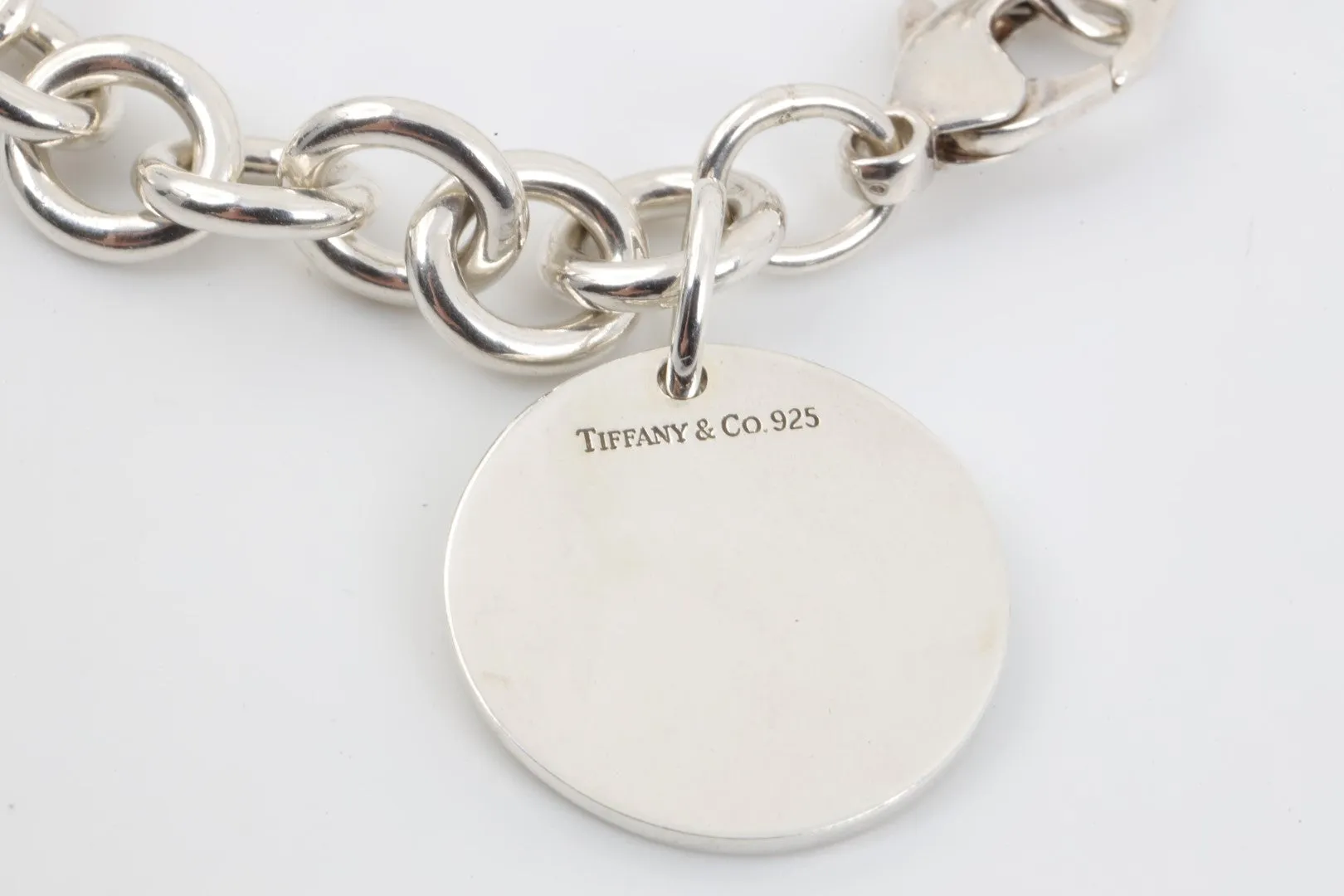 7.5" Tiffany & Co. 925 Silver Round Tag Bracelet (36.56g.)